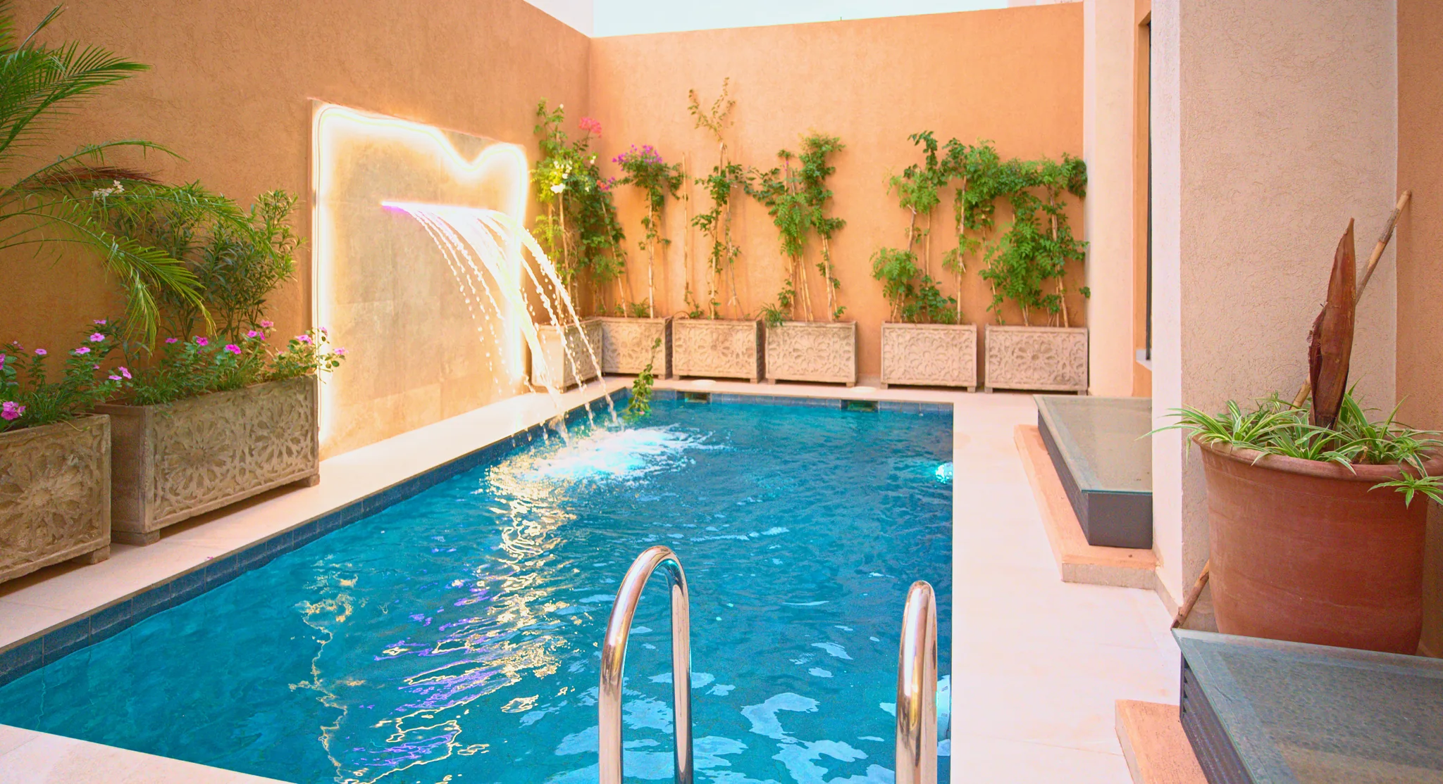 Private courtyard pool and waterfall at Villa Sheherazade, Marrakech